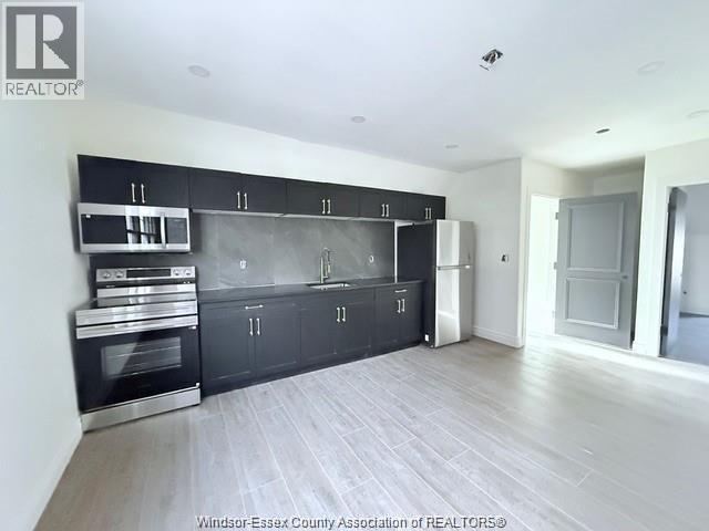 1-bedroom Single Family at 691 Ouellette #201, Windsor — photograph 2